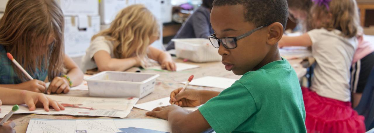 A young student working at a desk
