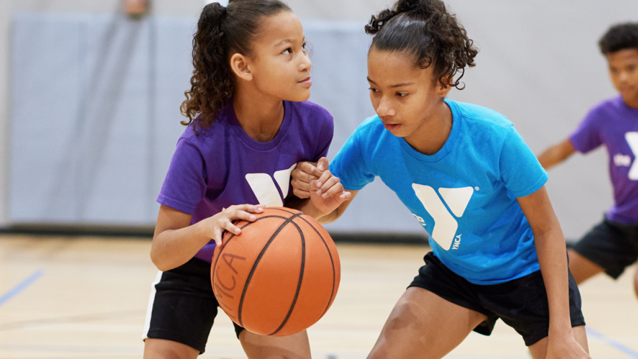 Youth Sports Basketball YMCA two girls playing basketball