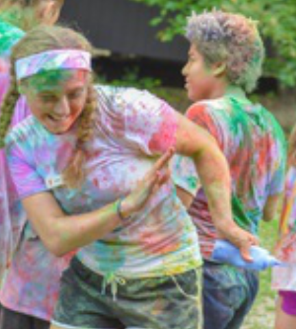 group of children at summer day camp in paint war t-shirt