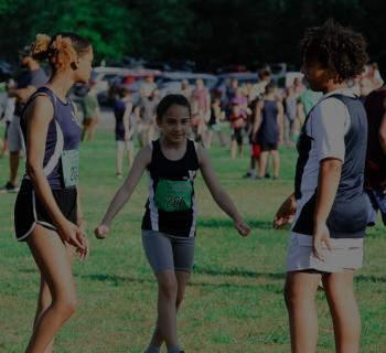 track_runners.jpg Three runners on track team in action